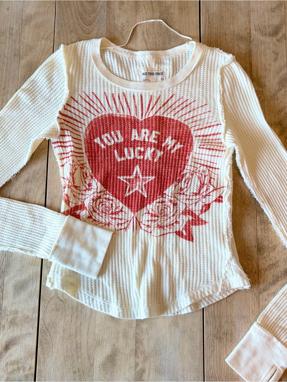 We The Free Cream Waffle Knit Long Sleeve Top with Red Heart Print